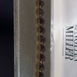 Brand new Nolan Miller glamour collection bracelet with deep purple stones